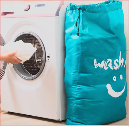 Teal Laundry Bag beside a washing machine